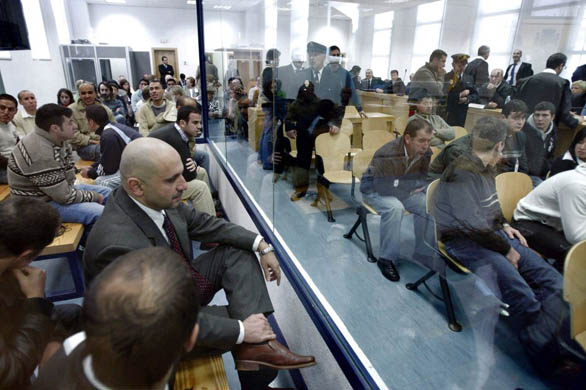 Some of the 28 suspects accused of the 2004 Madrid train bombings inside an annex of the high court
