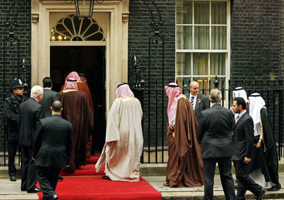 King Abdullah of Saudi Arabia's entourage walk into 10 Downing Street