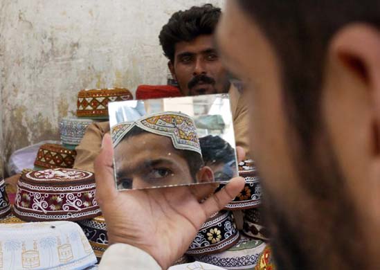 A man chooses a religious cap
