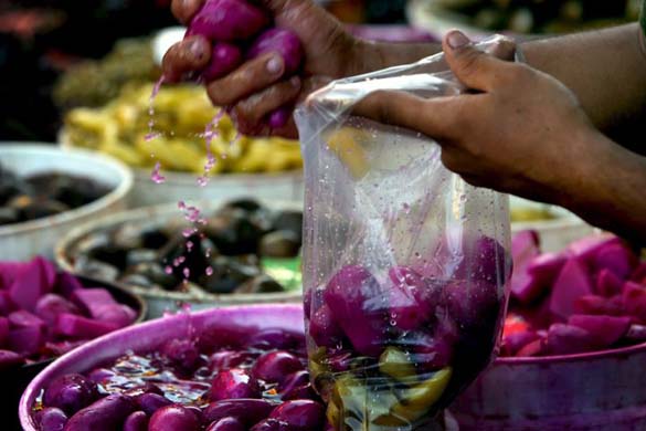 Palestinians shop at a market