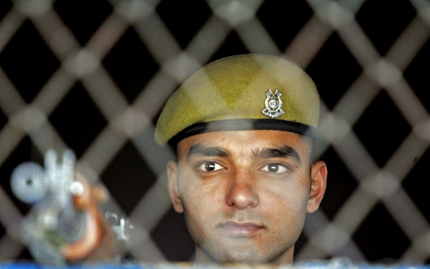 A policeman stands guard in Srinagar