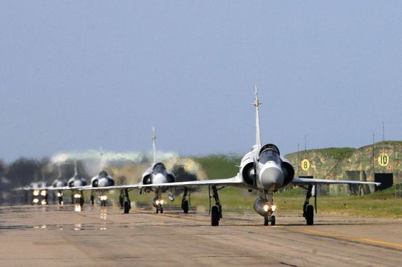 A group of Mirage fighter planes prepare to take off