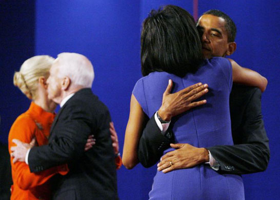 Presidential candidates  Barack Obama  and John McCain hug their respected spouses after their final presidential debate at Hofstra University  