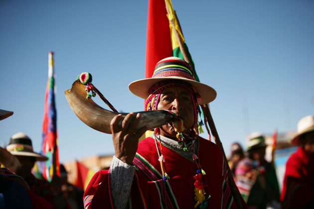 Government supporters continue their march on the capital to demand a referendum on proposed reforms in Bolivia 