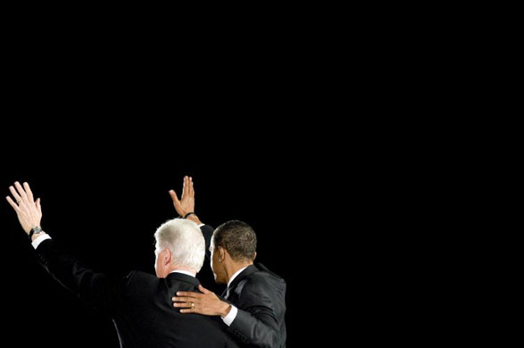 Barack Obama and former president Bill Clinton   wave to the crowd at a campaign rally