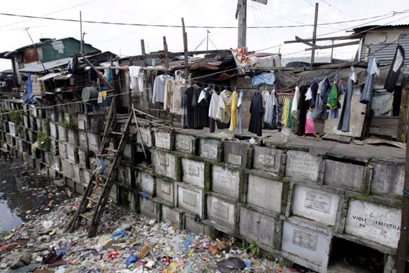cemetery used as housing in manila