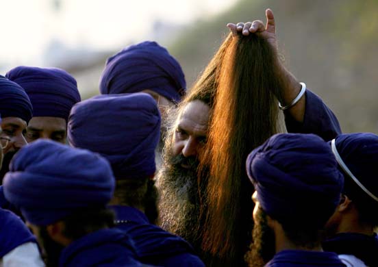 Sikh man ties his hair