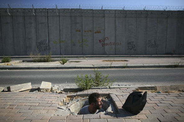 A Palestinian man makes his way to the Al Aqsa mosque