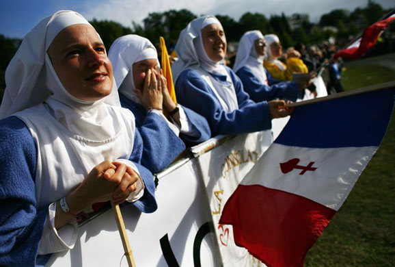 French Nuns listen to the Pope's mass at Lourdes 