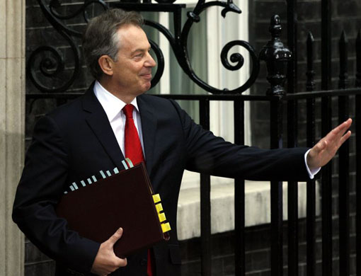 Tony Blair waves to the media before leaving for prime ministers questions