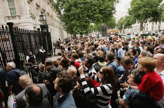 The public watch Mr Brown deliver a speech as new prime minister