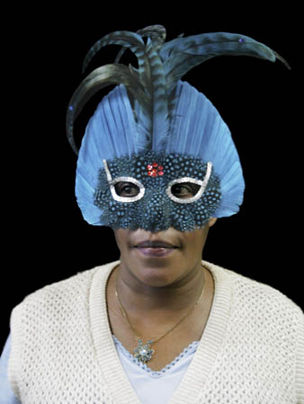 Many of the women are identified only by their first names. This is Gloria in a blue mask