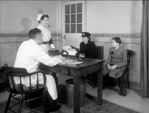 Patients visit GP in NHS run centre circa 1948