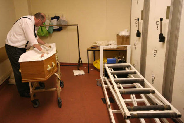 Final dressing and preparations before funeral and viewing in chapel of rest