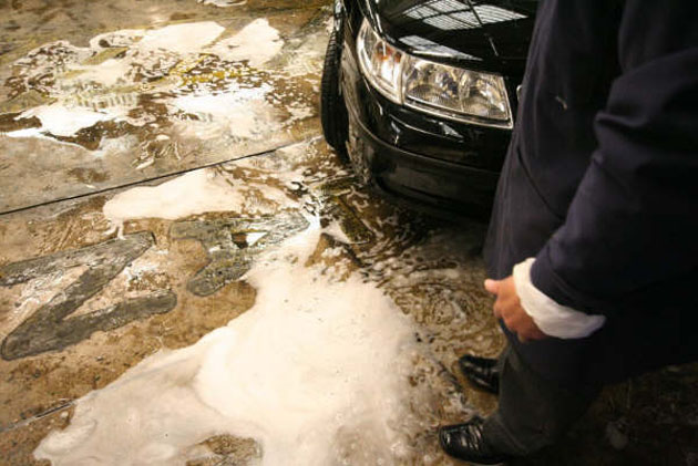 Fleet of cars cleaned before a funeral