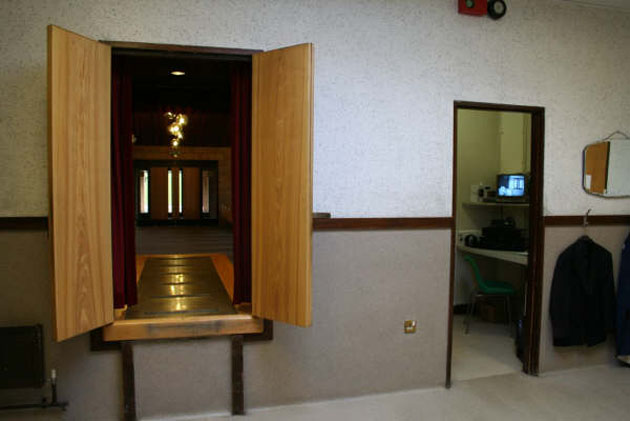 Control room behind the crematorium chapel, from where music and curtains are operated