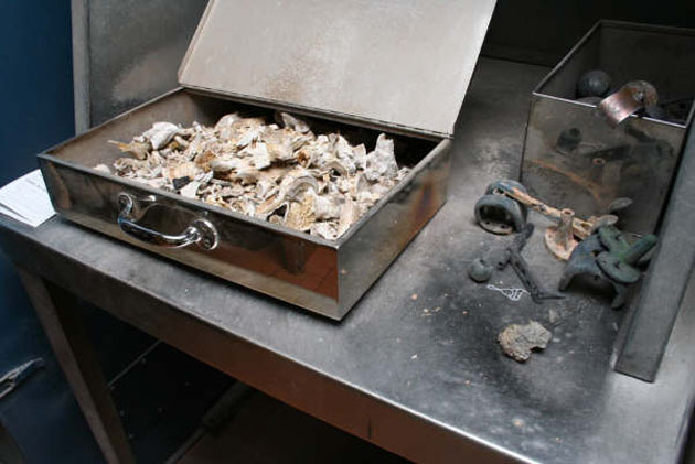 Cremated remains - and metal objects - which are removed and then buried in consecrated ground, before ashes are processed. Some are prosthetic body parts, others  are personal effects.  They have all whithstood temperatures of more than 900C in the furnaces