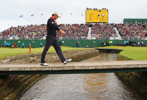 Padraig Harrington crosses a bridge