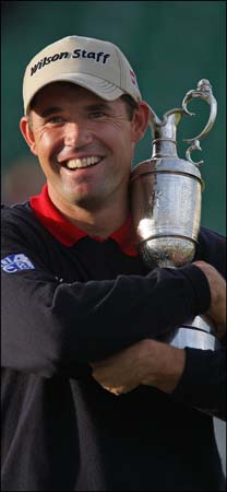 Padraig Harrington holds the trophy