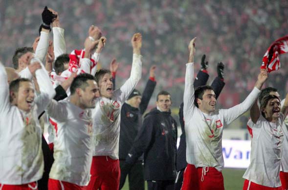 Polish players celebrate after beating Belgium