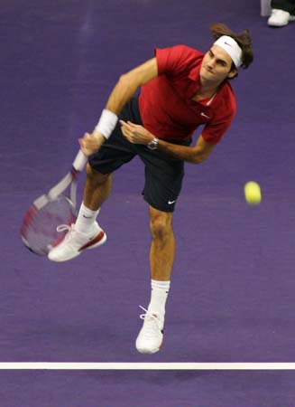 Federer returns a ball