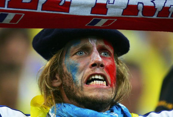 A French fan sings the national anthem