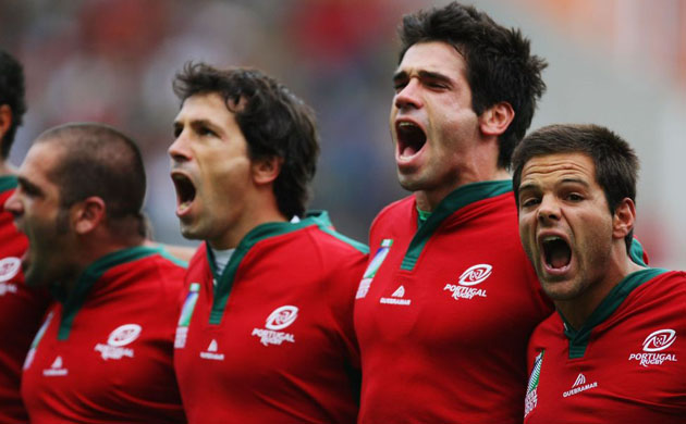 Pedro Leal (far right) of Portugal sings the national anthem with his team-mates