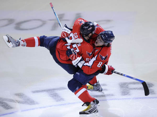 Ice Hockey. Washington Capitals' Mike Green celebrates his goal with Alex Ovechkin 