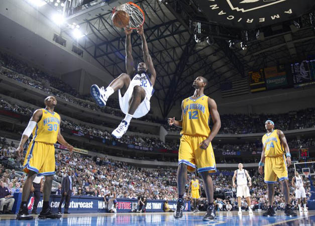 Brandon Bass of the Dallas Mavericks goes up for the dunk against Hilton Armstrong of the New Orleans Hornets