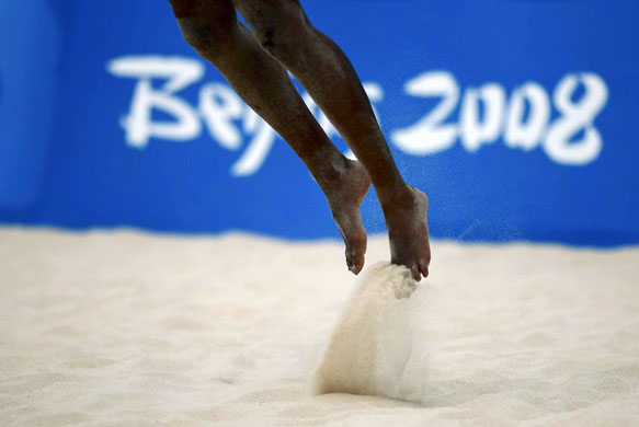 Milagros Crespo of Cuba jumps during beach volleyball training