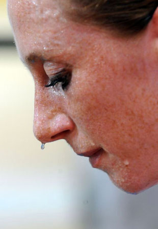 Track cyclist Wendy Houvenagel of Britain sweats during a practice at the Laoshan Velodrome