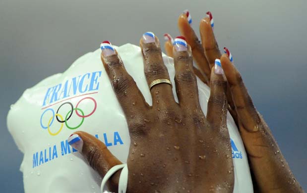 Malia Metella adjusts her cap