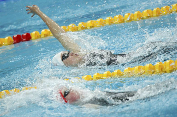Katie Hoff of the U.S. (top) and Hannah Miley of Britain swim in their women's 400m individual medley swimming heat