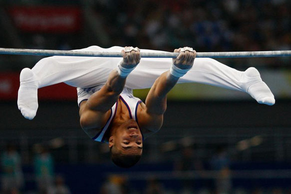 Louis Smith of Great Britain competes on the high bar during the artistic gymnastics event in Beijing 