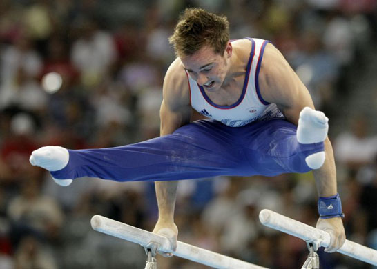 Britain's Daniel Keatings performs at the parallel bars at the Beijing 2008 Olympics in Beijing