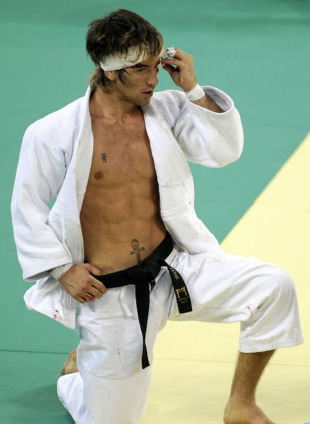 Great Britain's Craig Fallon bleeds during his men -60kg preliminary match of the 2008 Beijing Olympic Games against Morocco's Younes Ahmadi in Beijing