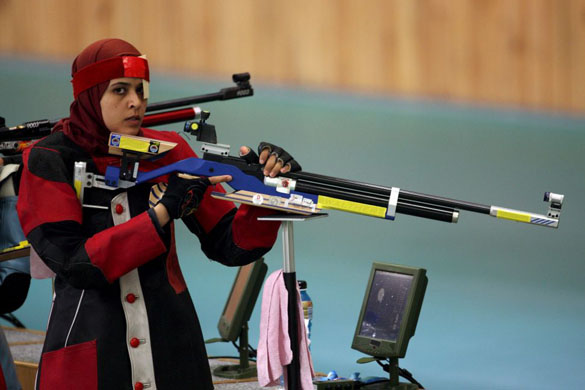 Shimaa Hashad of Egypt shoots during the 10m air rifle women's qualification in the Beijing Shooting Range Hall 