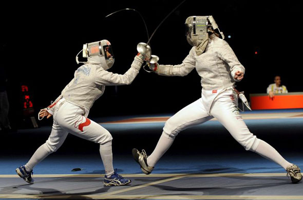 Irena Wieckowska (L) from Poland and Siobhan Claire Byrne from Ireland compete in the women's individual Sabre in Beijing