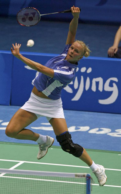 Ragna Bjorg Ingolfsdottir of Iceland returns a shot during her badminton singles first round match against Eriko Hirose of Japan in Beijing 