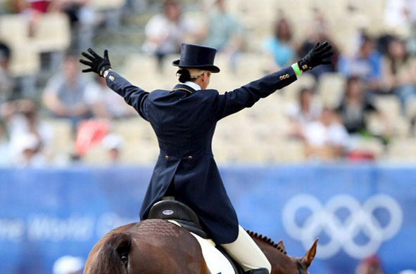 Australian eventing rider Lucinda Fredericks reacts after her performance on her horse Headley Britannia in Hong Kong 