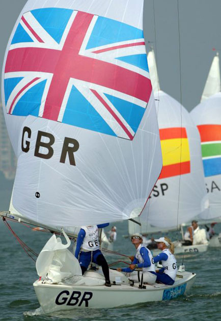 British Yngling sailors Sarah Ayton, Sarah Webb and Pippa Wilson in action during first race in front of Qingdao Olympic sailing area