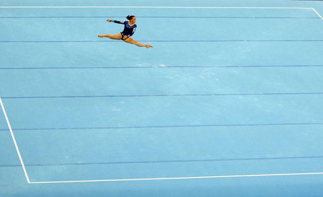 Beth Tweddle performs her floor exercise during qualification round for the women's artistic gymnastics
