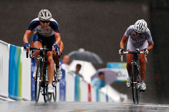 Nicole Cooke wins Team GB's first gold medal after her victory in the Women's road cycling race 