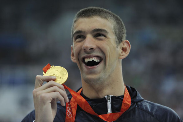 Michael Phelps with his gold medal for winning the mens 400m individual medley