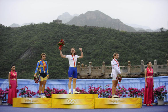 Nicole Cooke of Great Britain with her gold medal after winning the womens road cycling race