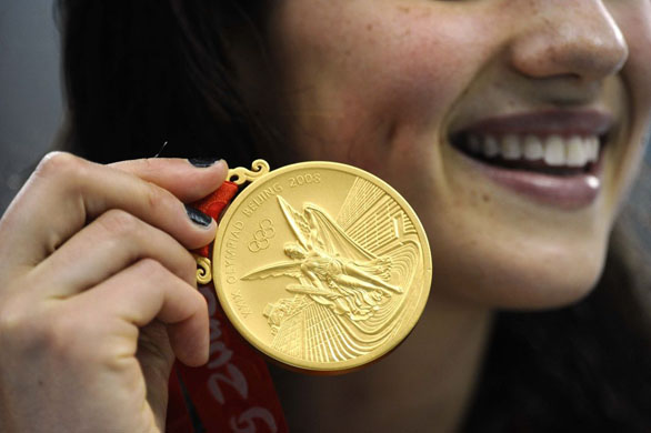 Stephanie Rice of Australia holds her gold medal as she celebrates victory in the final of the womens 400m individual medley