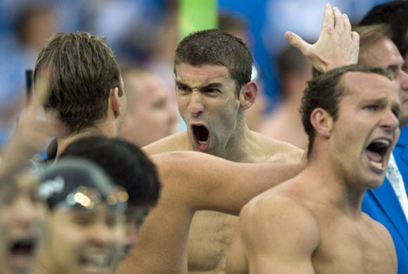 Michael Phelps celebrates with team mate 
