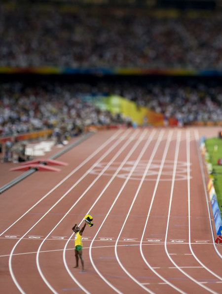 Usain Bolt celebrates winning the mens 100m