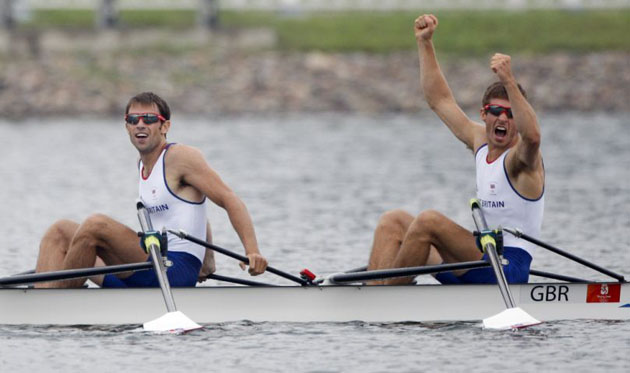 Great Britain's Zac Purchase, right, and Mark Hunter, left, celebrate their win in the lightweight men's double sculls 