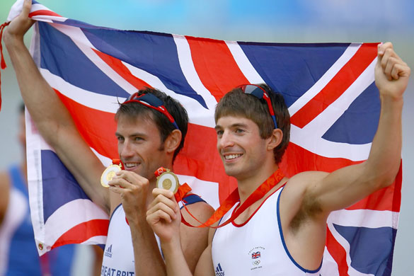 Zac Purchase and Mark Hunter of Great Britain celebrate their gold medal